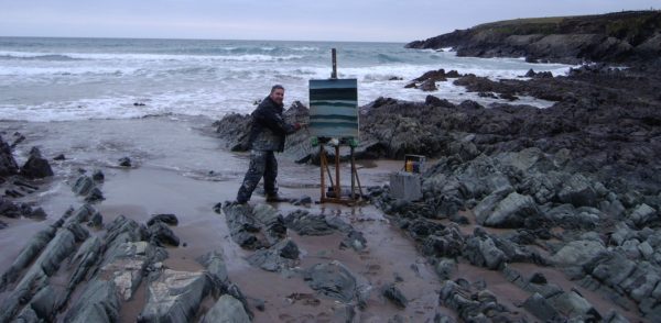 Rod Coyne painting the Kerry coastline up to his ankles in the Atlantic