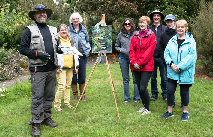 Happy painting students with their tutor, Rod Coyne, team photo.