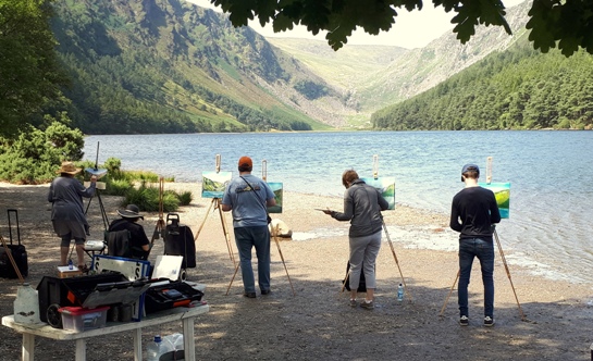 Painting students working on the shores of Glendalough Lake, just one venue in the Painting Holiday 2018.