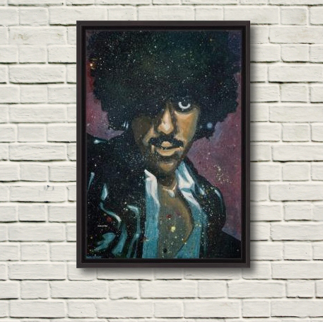 This photo depicts Rod Coyne's 'Phil "Philo" Lynott' canvas print in a black frame. The rustic brick wall gives a sense on the 100x70cm painting size.