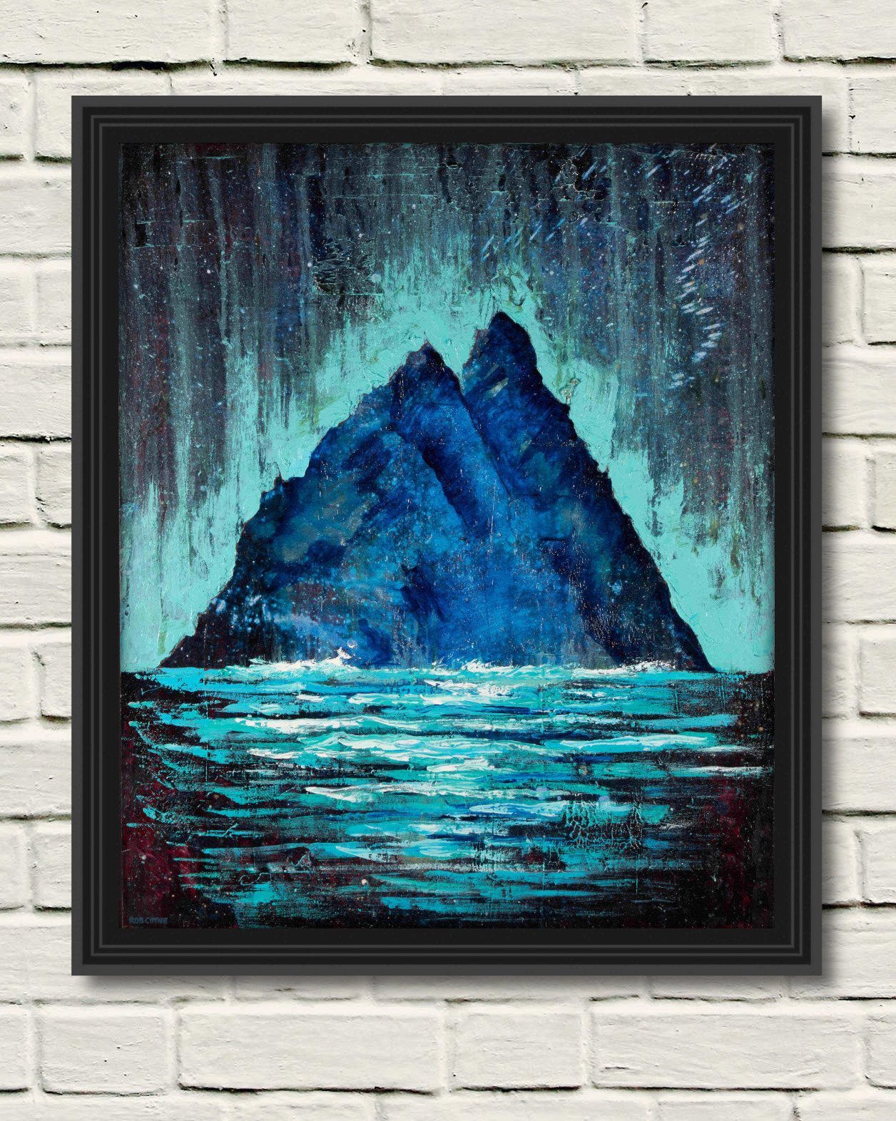 rod coyne's picture "Skellig-Phospheresence" displayed on a white wall in a black frame