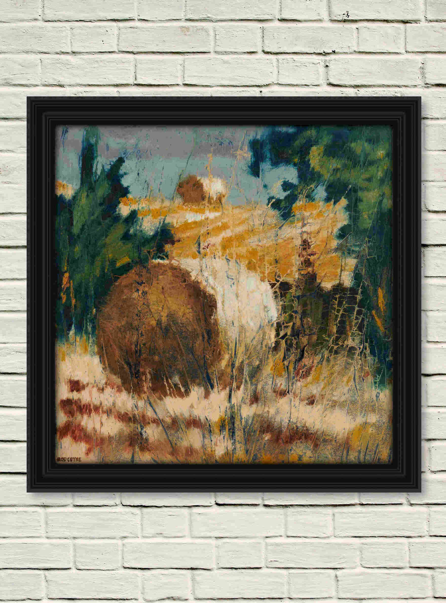 artist rod coyne's landscape "Bale on the Hill" is shown here, in black frame on a white wall.