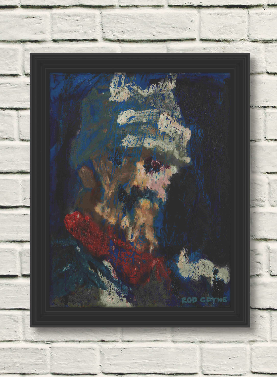 artist rod coyne's portrait "Don Quiote" is shown here on a white brick wall in a black frame.